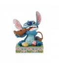 Figura enesco diseny stitch comiendo conejo de chocolate con huevos